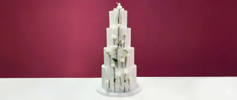 Elegant tiered wedding cake with clean modern lines, a custom cake by Cakes By Vjollca in Pristina, Kosovo